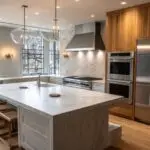 Warm kitchen interior with olive cabinets and gold fixtures
